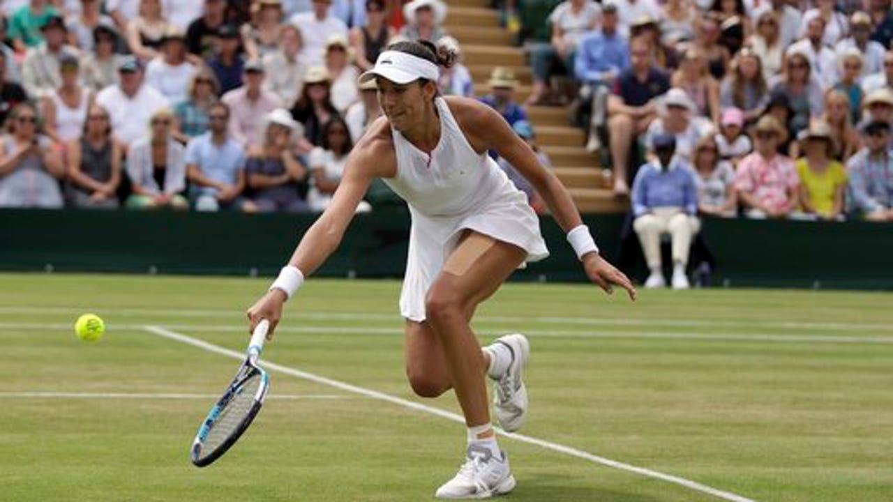 The Latest: Play on some courts at Wimbledon delayed by rain